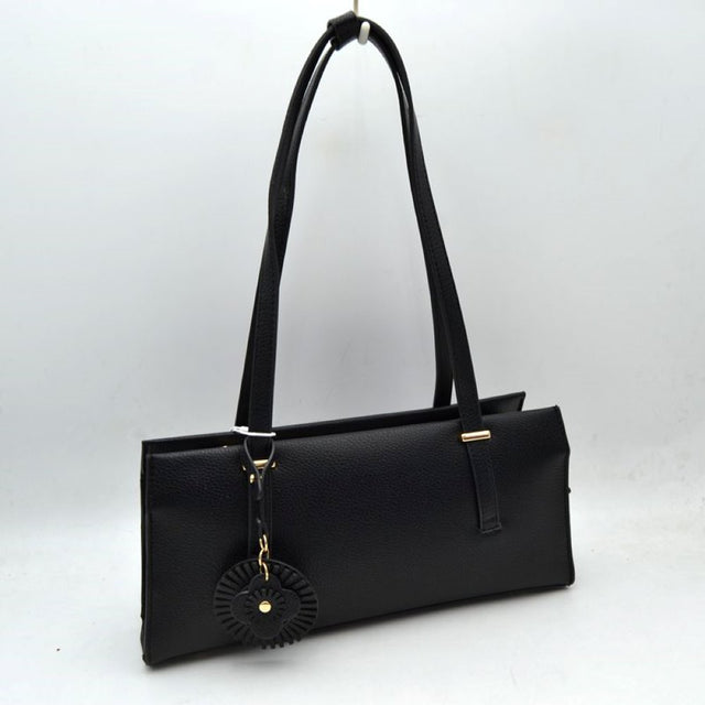 Black Upgrade your everyday style with this sleek and sophisticated black shoulder tote bag. Designed with a modern rectangular silhouette, this handbag combines elegance and practicality for daily use. Crafted from textured faux leather, it features comfortable shoulder straps, a spacious interior, and a stylish decorative charm for a fashionable finishing touch. Perfect for work, shopping, casual outings, or evening occasions, this versatile bag complements both formal and casual wardrobes.