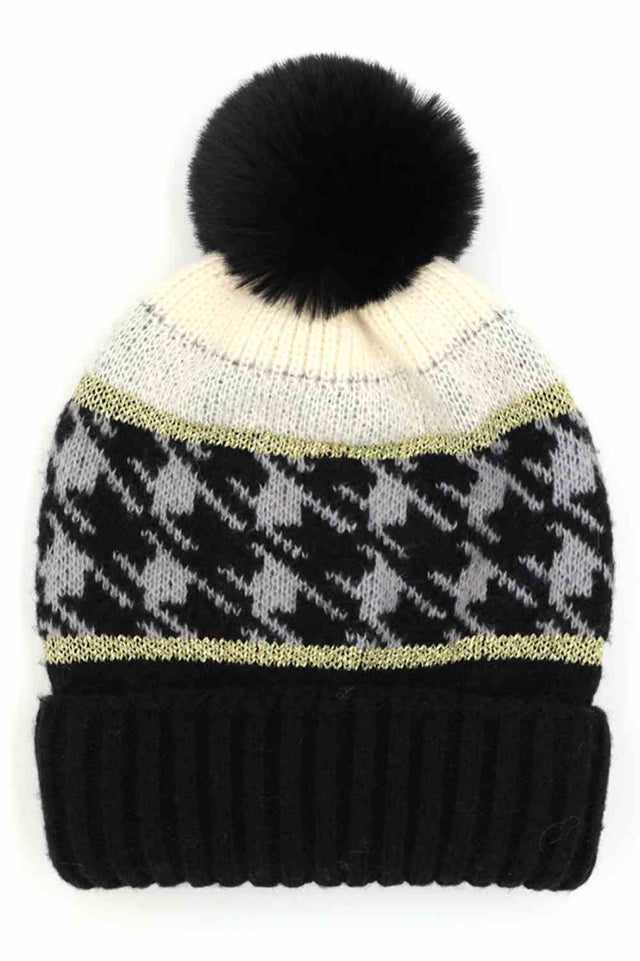 Black Houndstooth PomPom Beanie features a classic houndstooth knit pattern topped with a fluffy pom for a stylish, winter-ready look. Finished with a soft stretch fit, it keeps you warm and comfortable while adding timeless charm to your cold-weather outfits.