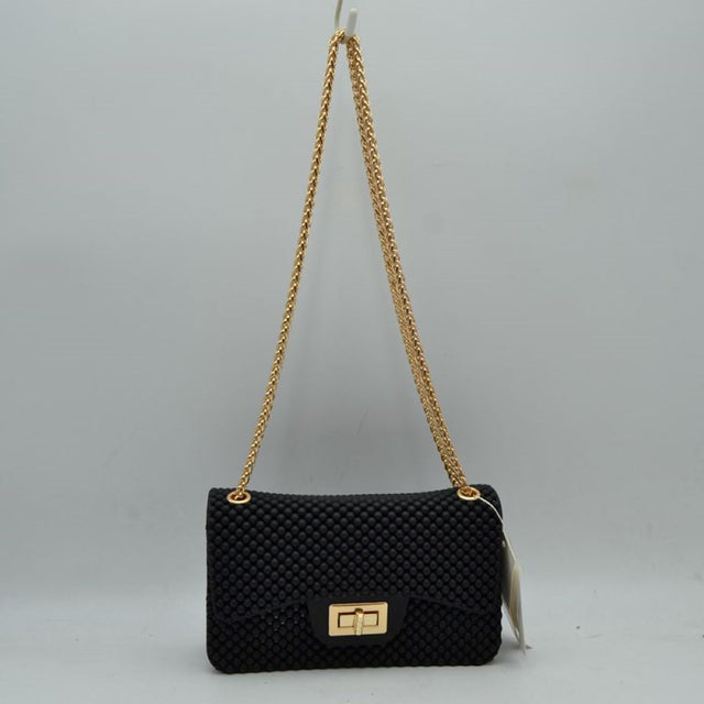 Black This rectangular flap bag showcases a distinctive all-over bumpy textured design that adds unique tactile interest, making it a stylish choice for everyday use. The main storage compartment is safely secured by a front flap featuring a metallic twist-lock closure. Designed for easy carrying, the bag incorporates a long metallic chain shoulder strap fed through top eyelets, allowing it to rest comfortably on the shoulder throughout the day.