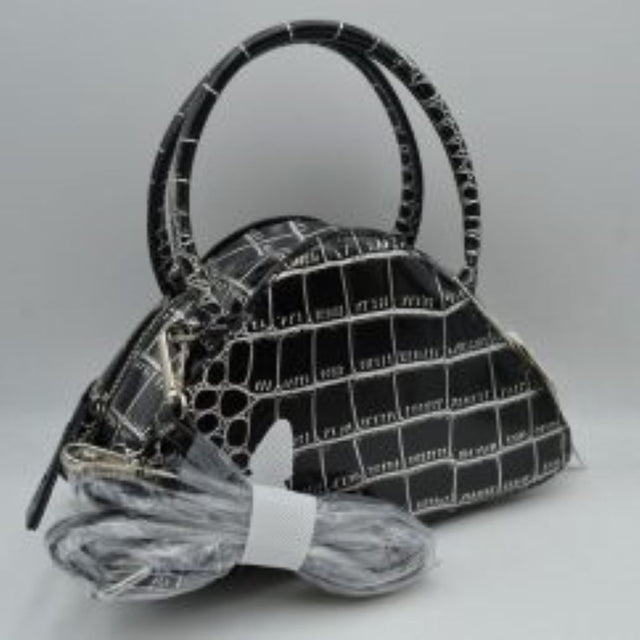 Black This stylish dome satchel features a structured silhouette w/ a distinct embossed tile-like pattern, making it an excellent accessory for everyday use. Designed w/ a secure top zipper closure equipped w/ an extended pull tab, it opens to a main compartment perfect for keeping daily essentials protected. Dual rolled top handles offer a comfortable grip for handheld carrying, while an included detachable shoulder strap connects easily w/ metallic clasps to provide versatile hands-free carrying options.