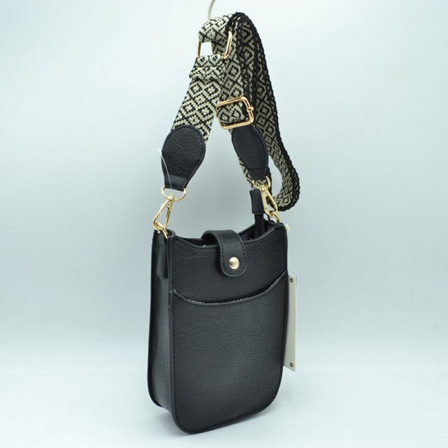 Black This compact crossbody bag features a lightly textured finish and a slim, vertical pouch silhouette designed for convenient everyday use. It includes dedicated storage compartments, consisting of an easily accessible open front slip pocket and a main top compartment secured by a small fold-over tab with a gold-tone snap closure.