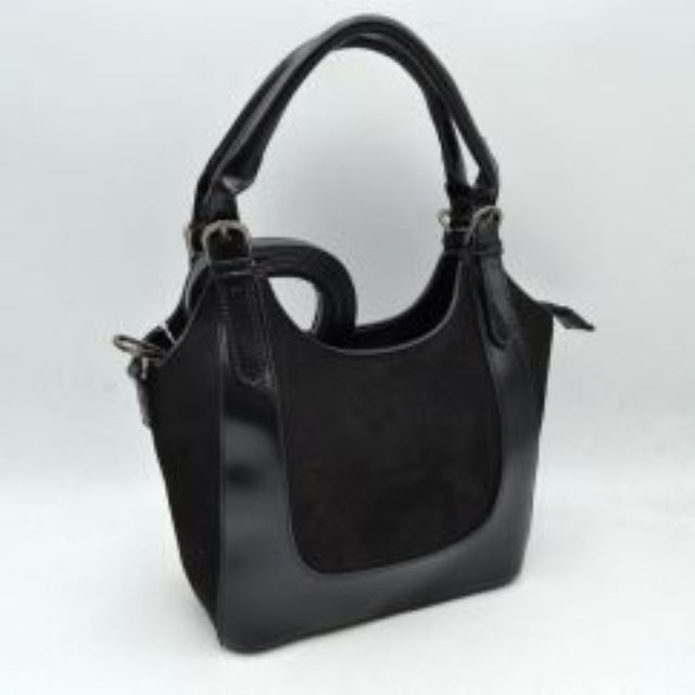 Black This unique handbag features a fluffy, plush texture across its entire exterior, offering a soft and tactile finish for distinctive everyday use. It showcases a slouchy, curved silhouette highlighted by an integrated top handle that features a prominent twist knot detail on one side. The open-top design allows for quick and convenient access to the main storage compartment, making it a playful yet functional accessory for carrying your daily essentials.