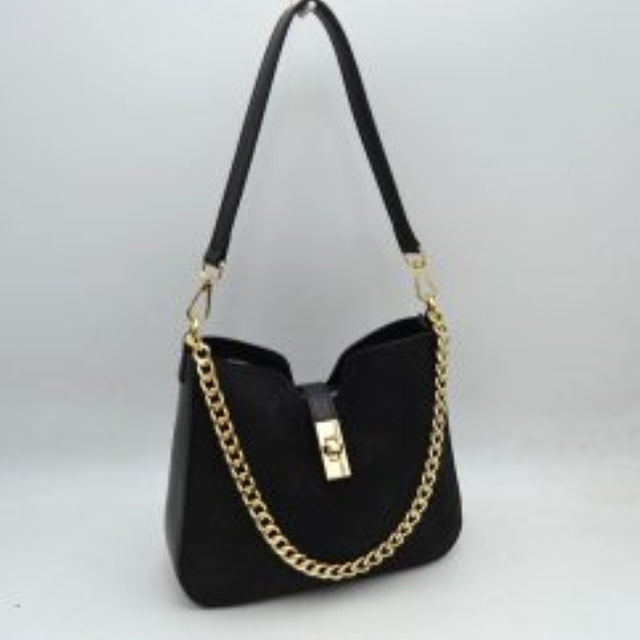Black This stylish shoulder bag features a sleek structured silhouette with a notched center dip, offering a modern aesthetic for daily or evening wear. Secured with a tab snap closure featuring a metallic turn-lock accent, it keeps your belongings safe while maintaining an open-access feel. It is detailed with a decorative gold-tone chain link draped across the front, along with a comfortable flat shoulder strap for easy over-the-shoulder carrying.