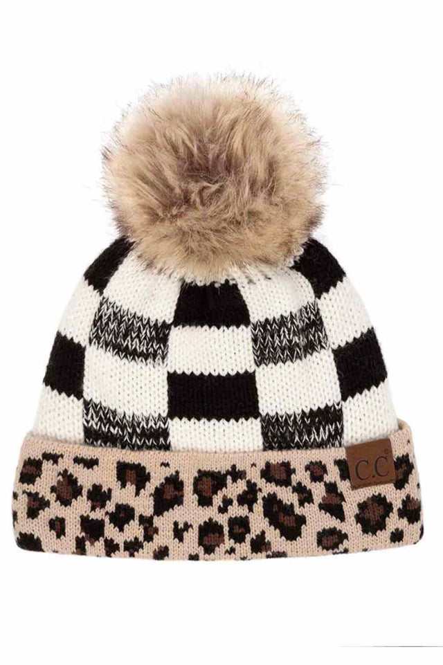 Black White The C.C Buffalo Check Beanie with Leopard Pattern Band features a bold buffalo check design accented with a contrasting leopard print band for a trendy, eye-catching winter look. Crafted from soft, stretchy knit fabric, it provides cozy warmth and a comfortable, snug fit for cold-weather wear.