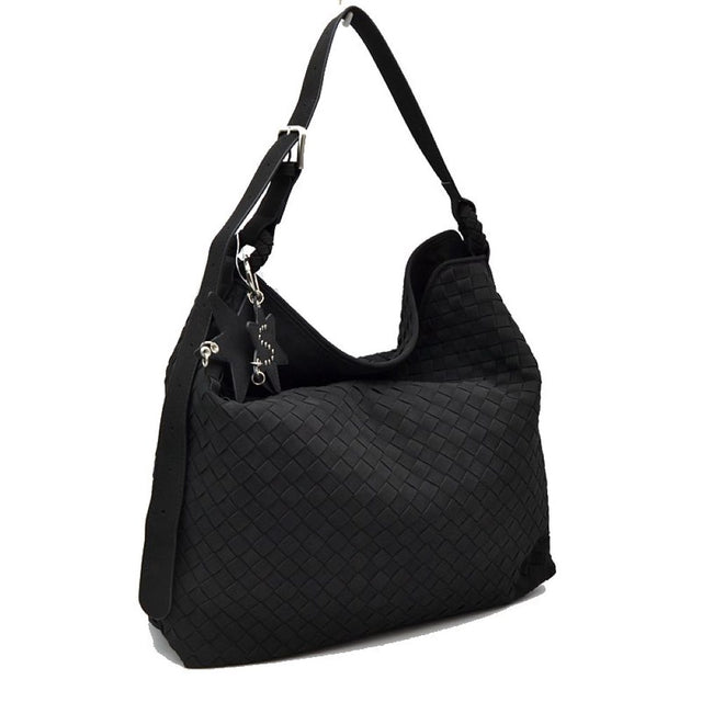 Black This slouchy hobo bag features a distinctive woven pattern across its exterior, offering a textured and modern look for everyday use. Designed with a spacious main compartment to easily accommodate daily essentials, the bag includes an adjustable flat shoulder strap secured with a metallic buckle for customizable carrying comfort. A decorative star-shaped charm is attached to the side via metallic hardware, adding a unique accent to the overall clean design.