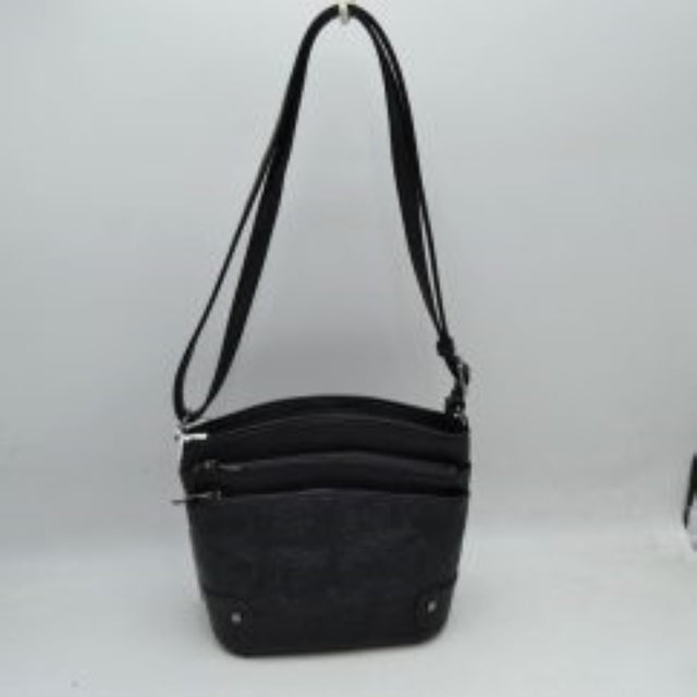 Black This functional crossbody bag features an elegant embossed floral pattern along the lower panel and a classic structured silhouette, ideal for daily organization. Designed with multiple storage options, it includes two main top-zippered compartments and a front zippered pocket with metallic hardware pull tabs to keep your essentials organized. A long, adjustable shoulder strap allows for comfortable, hands-free carrying over the shoulder or across the body.