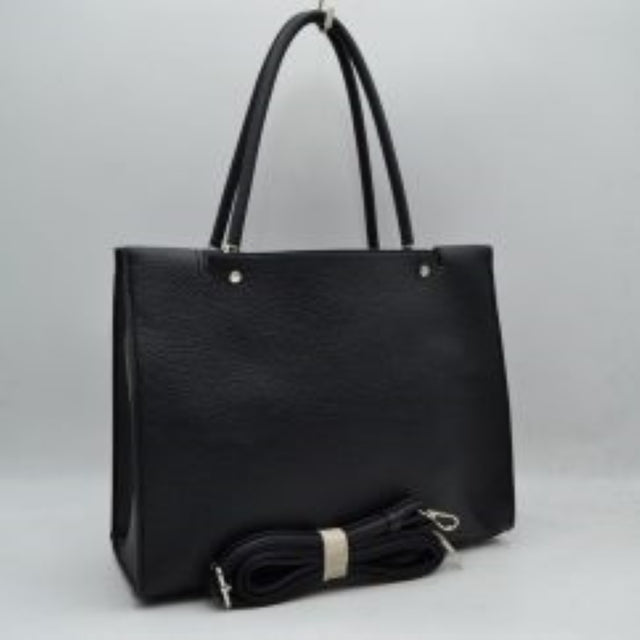 Black This structured tote bag features a clean, minimalist silhouette with a finely textured exterior finish, making it an excellent choice for versatile everyday use. It is equipped with long, rounded dual top handles secured by small metallic rivets for a comfortable shoulder or hand carry. The open-top design reveals a spacious main storage compartment, and the bag comes complete with a matching detachable long strap with metallic clasps for optional crossbody styling.