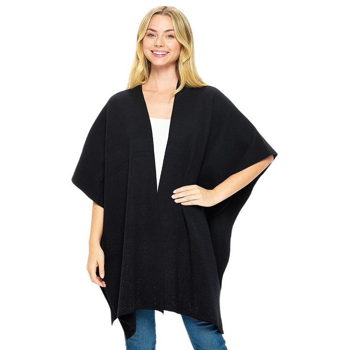 Black Jet Bling Solid Ruana Poncho is a fashionable outfit. Crafted with a soft, luxurious  blend of 50% viscose, 25% nylon, and 25% polyester, this poncho provides a superior level of comfort and warmth. The one size fits all construction adds to its versatility. An essential piece for your wardrobe for winter season.