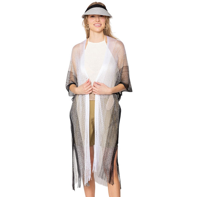 Black Two Tone Lurex Kimono Poncho is a versatile and stylish addition to any wardrobe. Made with a unique Lurex fabric, it adds a touch of shimmer to your outfit. Its kimono design offers a comfortable and flattering fit, making it suitable for any body type. Perfect for adding a pop of color and sparkle to your outfit. 