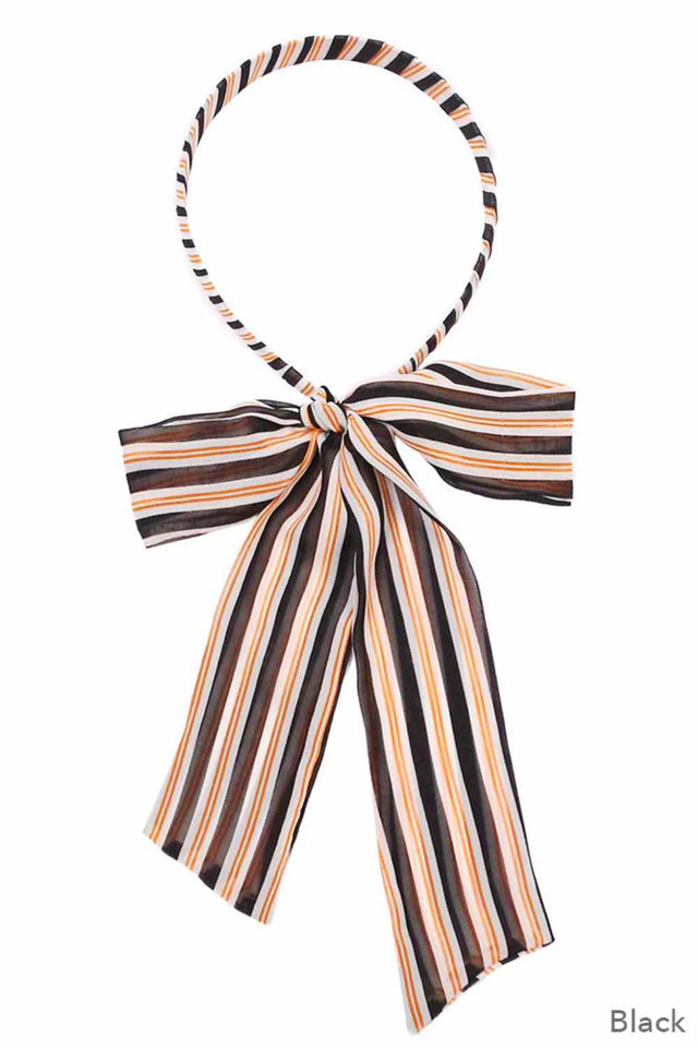 Black Keep your hair secure and stylish with this stripe print headband featuring a convenient ponytail opening. Crafted from 100% polyester, it's lightweight, durable, and easy to care for. The one-size-fits-most design works for everyone, making it perfect for workouts, casual outings, or everyday wear. The vibrant stripe pattern adds a pop of color to any look while keeping your hair in place all day long.