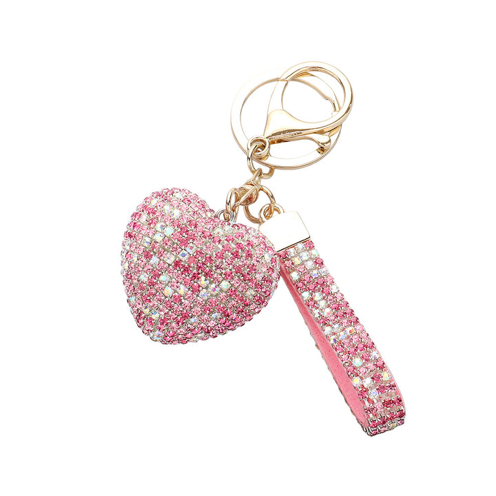 Bling Heart Keychain is a stylish accessory that adds a touch of elegance to your everyday look. Made with high-quality materials, it features a sparkling heart design that will catch everyone's eye. Perfect for keeping your keys organized and adding some glam to your day. 