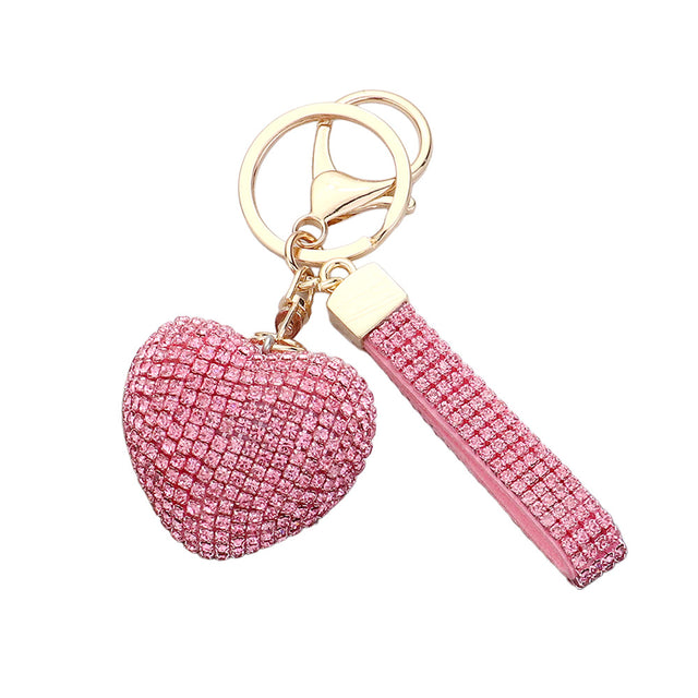 Pink Bling Heart Bag Charm is a stylish accessory that adds a touch of elegance to your everyday look. Made with high-quality materials, it features a sparkling heart design that will catch everyone's eye. Perfect for keeping your keys organized and adding some glam to your day. 