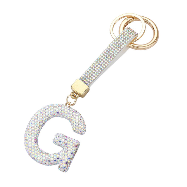 AB- Bling Studded Monogram Initial F Bag Charm adds a touch of elegance and personalization to any bag. Crafted with sparkling studs and featuring a monogram initial, this charm is the perfect accessory for the fashion-forward individual. Show off your unique style with this statement piece.