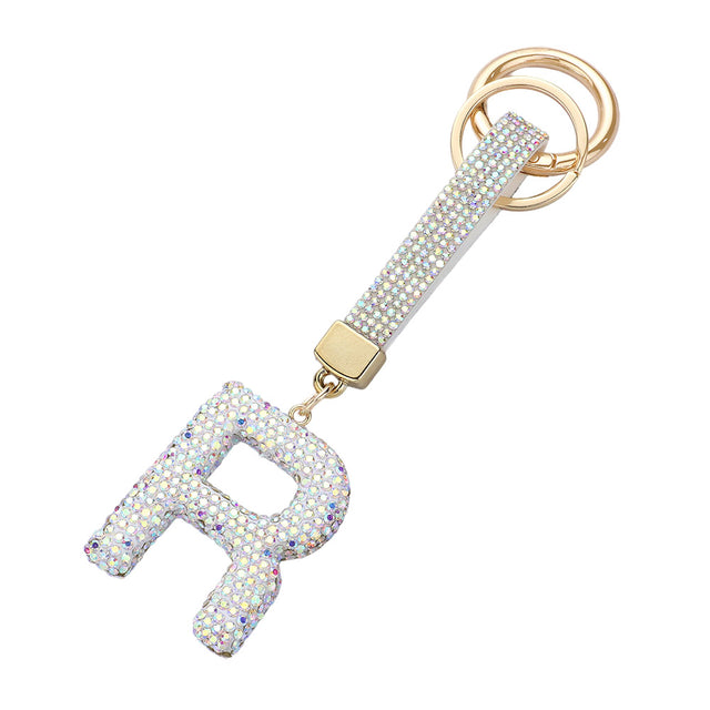 AB-Bling Studded Monogram Initial F Bag Charm adds a touch of elegance and personalization to any bag. Crafted with sparkling studs and featuring a monogram initial, this charm is the perfect accessory for the fashion-forward individual. Show off your unique style with this statement piece.