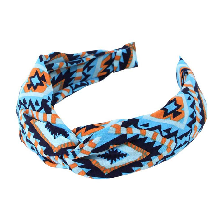 Blue Aztec patterned twisted headband is expertly designed to elevate your style while keeping your hair in place. Made with high-quality materials, it provides both functionality and fashion, giving you the best of both worlds. With its unique twisted design, this headband is perfect for any occasion.