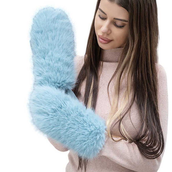 Blue-Faux Fuzzy Fur Mitten Gloves offer warmth and style in one. Made with soft, faux fur material, they are perfect for keeping your hands cozy during the colder months. With their unique mitten design, they provide added protection and functionality. Stay fashion-forward and comfortable with these must-have gloves. 