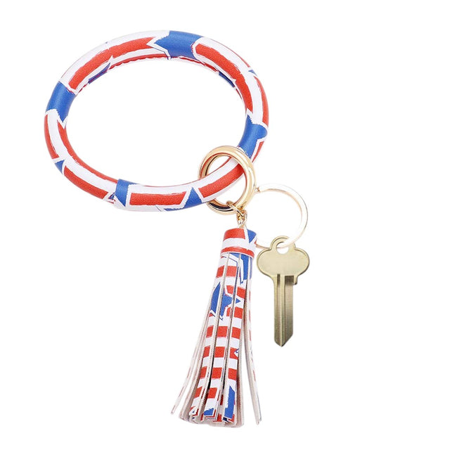 Blue Multi Red Patriotic USA Flag Faux Leather Tassel Keychain Bracelet is a stylish and functional accessory, perfect for showing your patriotic spirit. Made with faux leather and featuring a tassel keychain, this bracelet is both durable and trendy. Carry your keys with pride and complete any outfit with this versatile accessory.