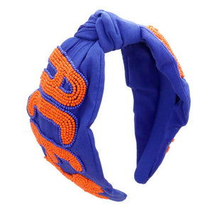 Blue Orange Get ready for the game with this Game Day Seed Beaded ACE Message Star Knot Burnout Headband. Crafted with soft material and adorned with seed beading, an ACE message, and a star knot, this headband is perfect for making a statement and staying comfortable at the same time. Cheer up your favorite team with this.