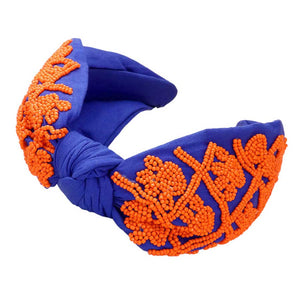 Blue Orange Be ready for game day with this stylish and comfortable Game Day Seed Beaded Paw Knot Burnout Headband. This headband is made from lightweight polyester and features a burnout design of paw knots with seed beads. Perfect for everyday wear, it's sure to make a statement and show your team spirit. 