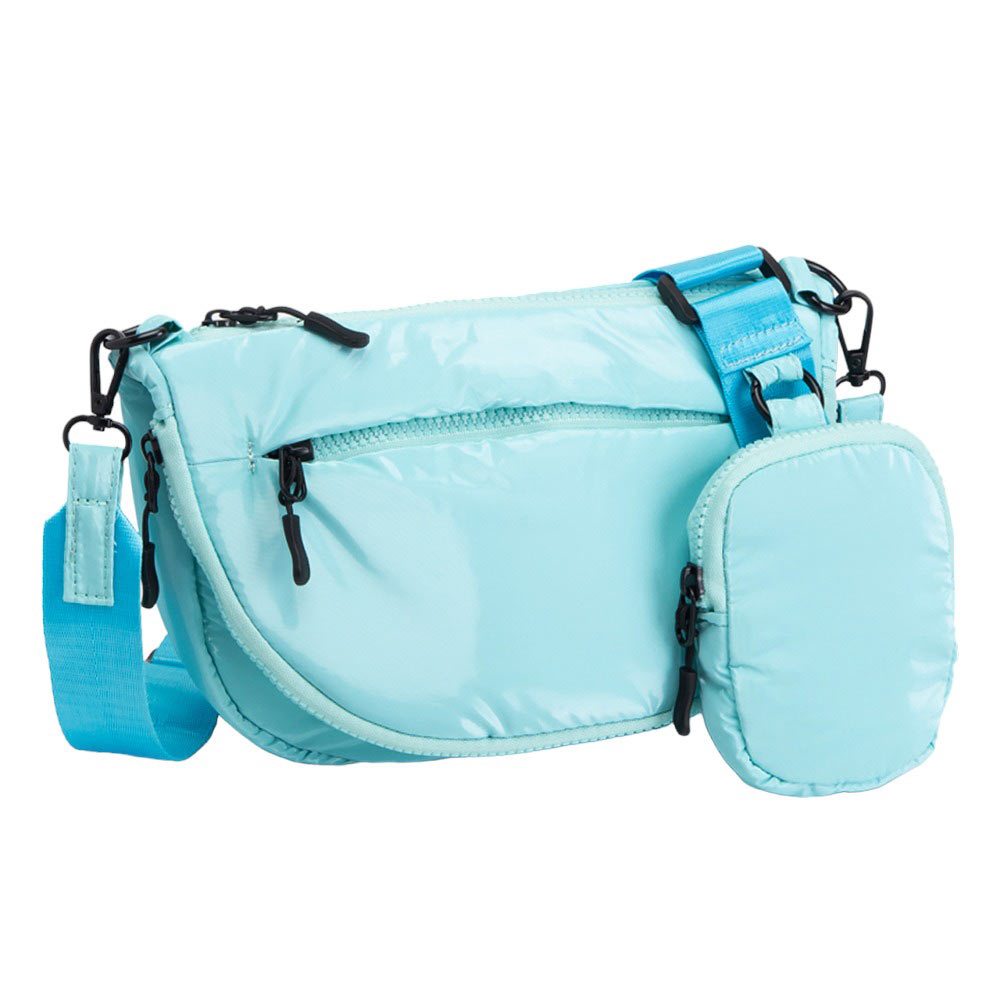 Blue Puffer Half Moon Crossbody Bag, the lightweight, stylish design features a durable water-resistant nylon that is perfect for outdoor activities. The adjustable shoulder strap makes it easy to sling across your body for hands-free convenience. Carry your essentials in style and comfort with this fashionable bag.