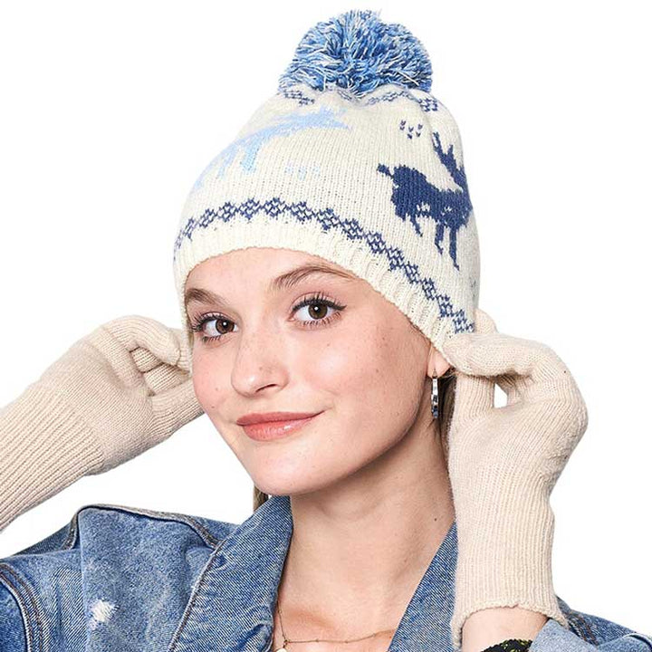 Blue Reindeer Nordic Pom Pom Beanie Hat, is perfect for enhancing any outfit all year round. It features a knitted texture and extra fluffy pom pom detailing for added warmth and protection. Keep yourself warm while looking great with this cozy winter hat in this Christmas festive and make a nice gift with this.