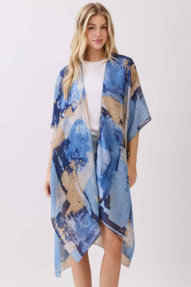 Blue Elevate your beach or resort wardrobe with this stunning Abstract Modern Art-Inspired Print Kimono. Crafted from 100% polyester with a luxuriously silky feel, this cover-up drapes beautifully over swimwear or casual outfits. The bold, contemporary print adds an artistic flair to any look, while the generous 35" x 36" dimensions provide comfortable coverage. Perfect for poolside lounging, beach days, or layering over your favorite pieces. Lightweight and easy to care for, this kimono is an effortless wa