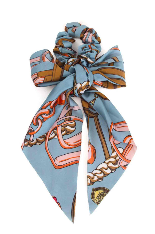 Blue Elevate your everyday look with this versatile Abstract Print Scarf Ponytail Holder. Crafted from 100% polyester, it combines functionality with style, doubling as both a hair accessory and a decorative scarf. The eye-catching abstract print adds a pop of color to any outfit, while the one-size-fits-most design ensures a comfortable fit for everyone. Perfect for securing your ponytail while making a fashion statement.
