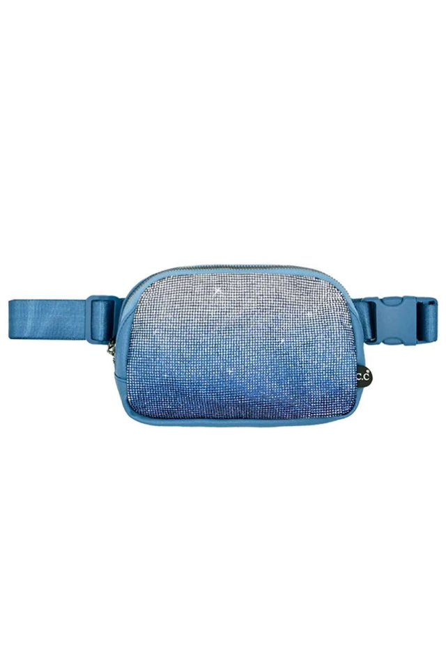 Blue Elevate your accessory game with the C.C Ombre Rhinestone Fanny Pack. This eye-catching piece features a stunning ombre design adorned with sparkling rhinestones that catch the light beautifully. Crafted from a durable blend of 50% PU and 50% polyester, it's built to last through all your adventures. With compact dimensions of 8.75" x 6" x 2", this fanny pack offers practical storage without the bulk. 