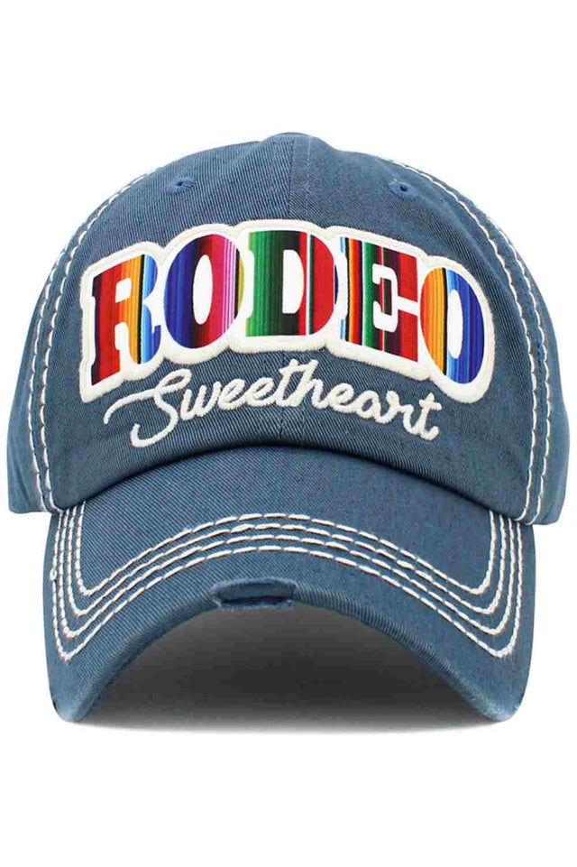 Blue RODEO SWEETHEART Vintage BaseCap blends western charm with a worn-in vintage look for a bold yet playful statement. Designed for all-day comfort, it’s the perfect finishing touch for casual outfits, festivals, or laid-back adventures.