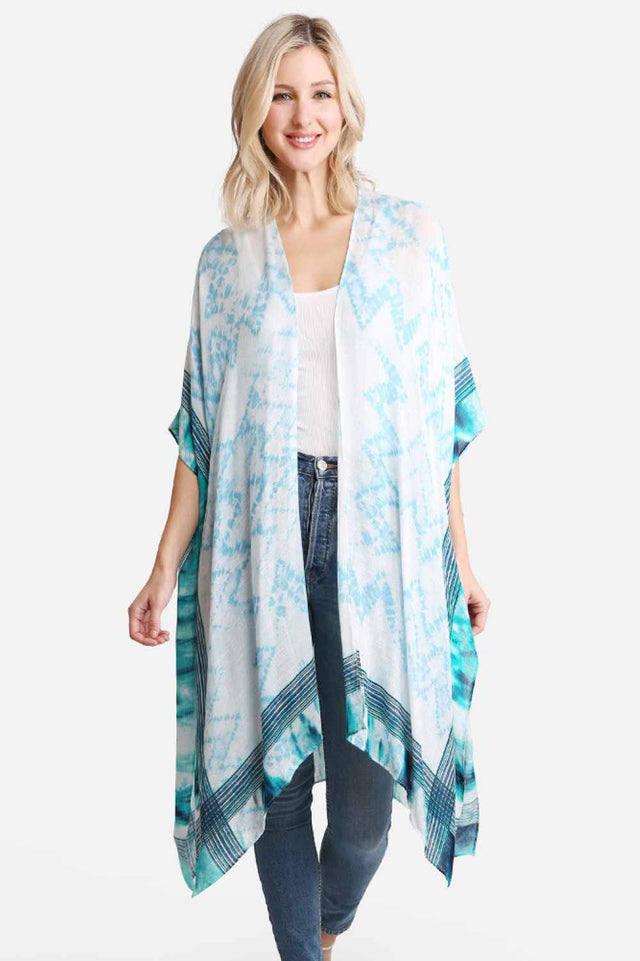 Blue Effortless summer style meets vibrant artistry with this tie dye zigzag pattern cover up. Crafted from 100% viscose, the lightweight fabric drapes beautifully over swimwear or casual outfits, offering breathable comfort on warm days. The eye-catching zigzag print in rich tie dye hues adds a playful, bohemian touch to any beach or resort look. Dimensions: 38" x 39" Material: 100% Viscose Origin: Made in China Perfect for layering over your favorite swimsuit or wearing as a standalone piece for an effort