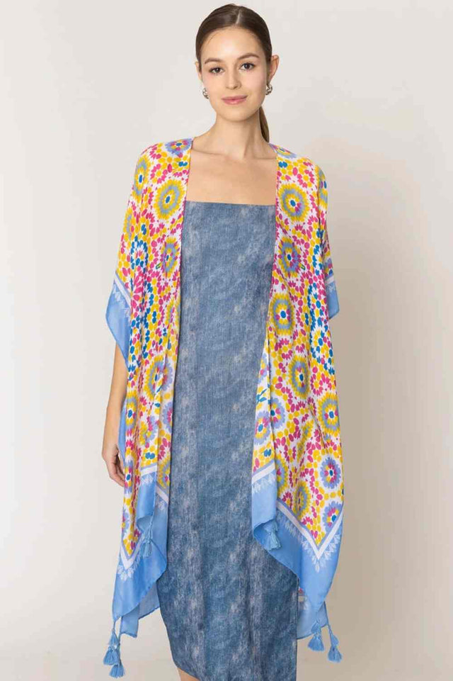 Blue Effortless elegance meets bohemian charm with this stunning tile print kimono. Crafted from lightweight 100% polyester, this versatile piece features a captivating geometric tile pattern with contrasting stripe detailing along the edges and playful tassels for added movement and flair. Perfect for layering over any outfit, this kimono drapes beautifully at 35.4" x 35.4", making it ideal for beach days, casual outings, or relaxed evenings.
