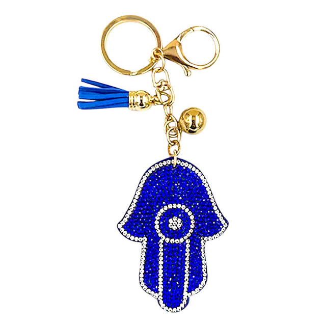Blue Bling Evil Eye Tassel Bag Charm adds a touch of glamour to any bag. The shiny, evil eye design is sure to catch everyone's attention. The tassel detail offers a playful touch, making this charm a unique accessory. Perfect for adding a little sparkle and charm to your bag. 
