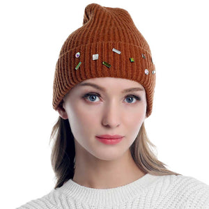 Brown Bling Stone Embellished Knit Beanie Hat, wear this beautiful beanie hat with any ensemble for the perfect finish before running out the door into the cool air. The hat is made in a unique style and it's richly warm and comfortable for winter and cold days. Perfect gift item for all occasions.