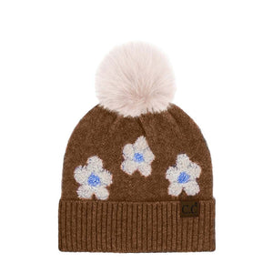 Brown C.C Daisy Pattern Beanie with Pom, stay warm and fashionable in this cozy, stylish beanie with pom. It's soft and warm and made from yarn for superior comfort. The playful pom accent adds a delightful touch of fun to any outfit. Awesome winter gift accessory for birthdays, Christmas, anniversaries, and family.