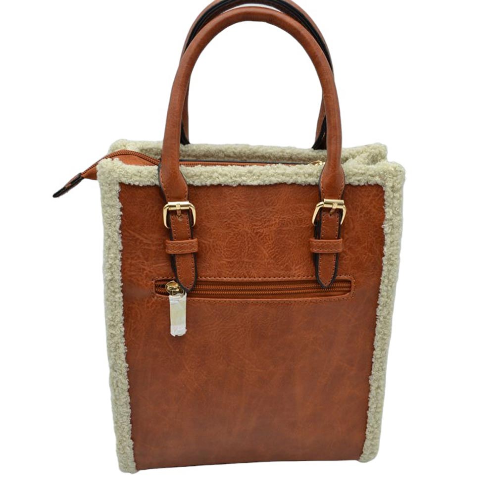 Brown Faux Shearling Trim With Detachable Strap Crossbody Tote Bag. This stylish bag features an elegant faux shearling trim and a detachable strap for extra versatility. The faux shearling trim provides a pleasant and luxurious feel to the bag. It is perfect for carrying your daily essentials, from books to work essentials.