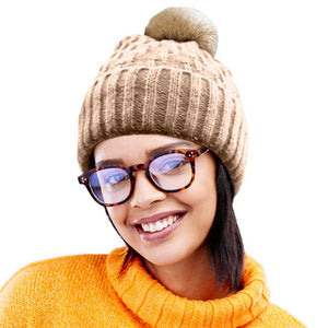 Brown Fleece Lining Solid Knit Faux Fur Pom Pom Beanie Hat, Stay warm and stylish this season with this hat. This classic hat is perfect for gifting, crafted with a solid knit and lined with soft fleece to provide superior warmth and comfort on cold days. Perfect winter accessory for outdoor activities.
