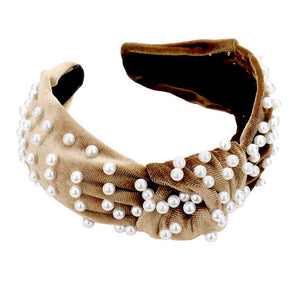Brown Pearl Velvet Knotted Headband, is the perfect accessory for any outfit. Crafted from luxurious pearl velvet, it will add a touch of sophistication to your look. Its knotted design will stay securely in place, making it ideal for any busy lifestyle. An ideal gift accessory for your family members and friends.
