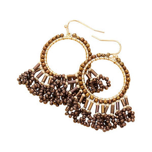 Brown Seed Beaded Fringe Metallic Tiered Circle Dangle Earrings, Inject some drama into your look with these stunning pieces. Crafted with layers of tiny seed beads and metallic circles, these beautiful earrings provide a unique and eye-catching addition to any outfit. A perfect accessory for any occasion.