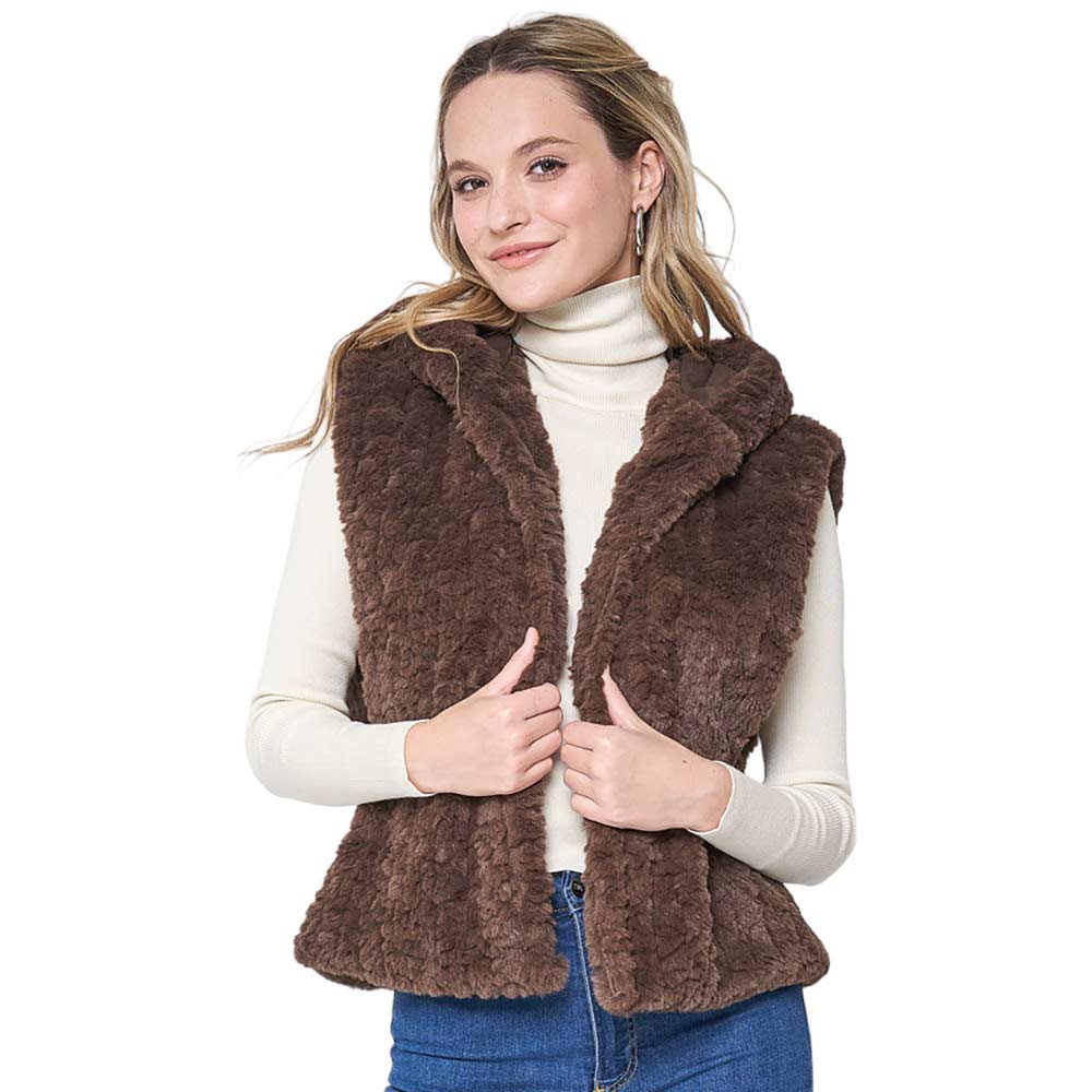 Black Solid Faux Fur Hooded Vest, is designed to keep you warm and stylish in the coldest of climates. Crafted from premium faux fur, this vest is sure to be a comfortable and stylish companion in any outfit. With a hood for additional protection and wind coverage, this vest is ideal for outdoor winter activities. 