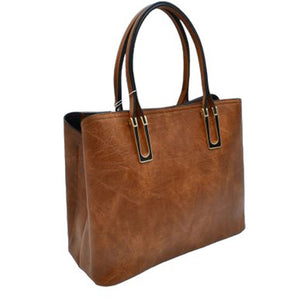 Brown Solid Faux Leather Tote Bag Shoulder Bag, is perfect for the modern woman. Crafted with genuine faux leather, this stylish bag is durable, light, and spacious, and with adjustable straps, it is perfect for everyday use. Its sleek design will have you turning heads wherever you go.