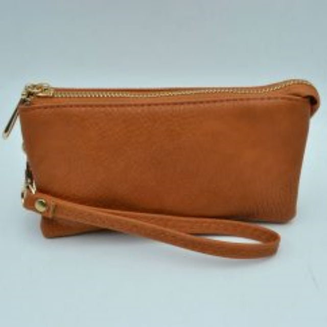 Brown This sleek pouch features a textured, pebble-grained finish and a slim rectangular silhouette suitable for organized everyday use. It is designed with secure top zipper storage compartments to keep your daily essentials protected while on the go, accented by a distinct metallic teardrop-shaped zipper pull. A matching detachable wristlet strap with detailed zig-zag stitching connects securely via a metallic clasp, providing a convenient and stylish option for handheld carrying.