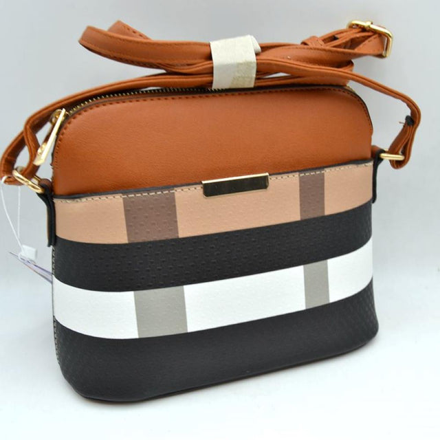 Brown This structured shoulder bag features a multi-patterned exterior showcasing horizontal bands and vertical blocks on the lower section beneath a solid upper panel. Designed for convenient everyday use, the bag includes a front slip pocket accented with a sleek rectangular hardware trim and a secure top zipper closure for the main storage compartment. A long, adjustable strap is connected via side rings and a buckle, allowing for versatile crossbody carrying options.