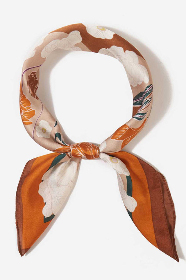 Brown Brighten your summer style with this charming floral pattern blocks bandana scarf. Crafted from lightweight 100% polyester, it's perfect for warm weather wear tie it around your neck, head, or wrist for effortless versatility. The generous 27.5" x 27.5" square cut offers plenty of styling options. Whether you're heading to the beach, running errands, or adding a pop of color to any outfit, this easy-care scarf keeps you cool and fashionable all season long.