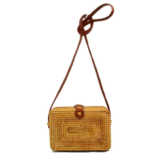 Brown Embrace effortless resort-style fashion with this beautifully structured, woven crossbody bag. Blending a classic bohemian aesthetic with everyday functionality, this hand-woven box bag is the ultimate accessory for beach days, brunch dates, and warm-weather vacations.