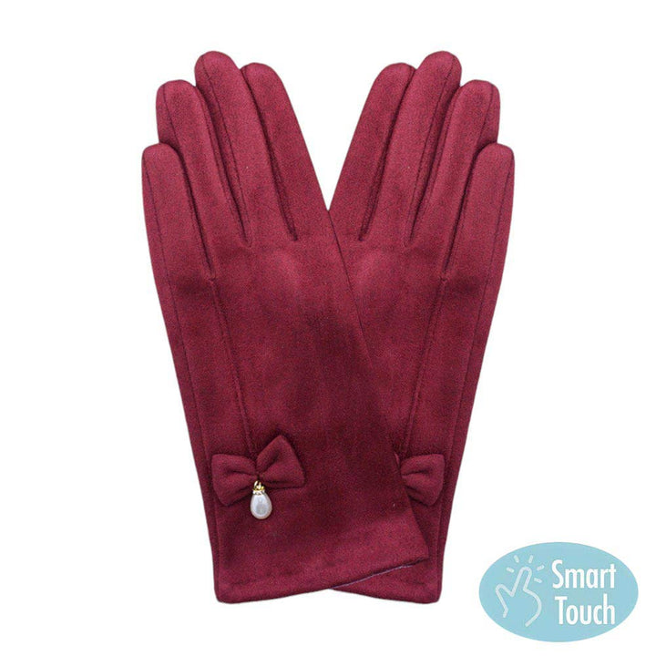 Burgundy Bow Pearl Dangle Pointed Faux Suede Smart Touch Gloves, these smart gloves designed for both stylish and practical use. With a smart touch feature, these gloves allow easy use of touchscreen devices. The faux suede material keeps your hands warm and comfortable, while the bow and pearl dangle add a touch of elegance.