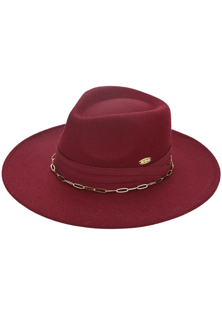 Burgundy C.C Link Chain & Pleated Wide Band Vegan Felt Hat is expertly crafted with a unique link chain design and a pleated wide band. Made with vegan felt, it offers a sophisticated and eco-friendly alternative to traditional hats. Elevate your style with this fashionable and sustainable accessory.