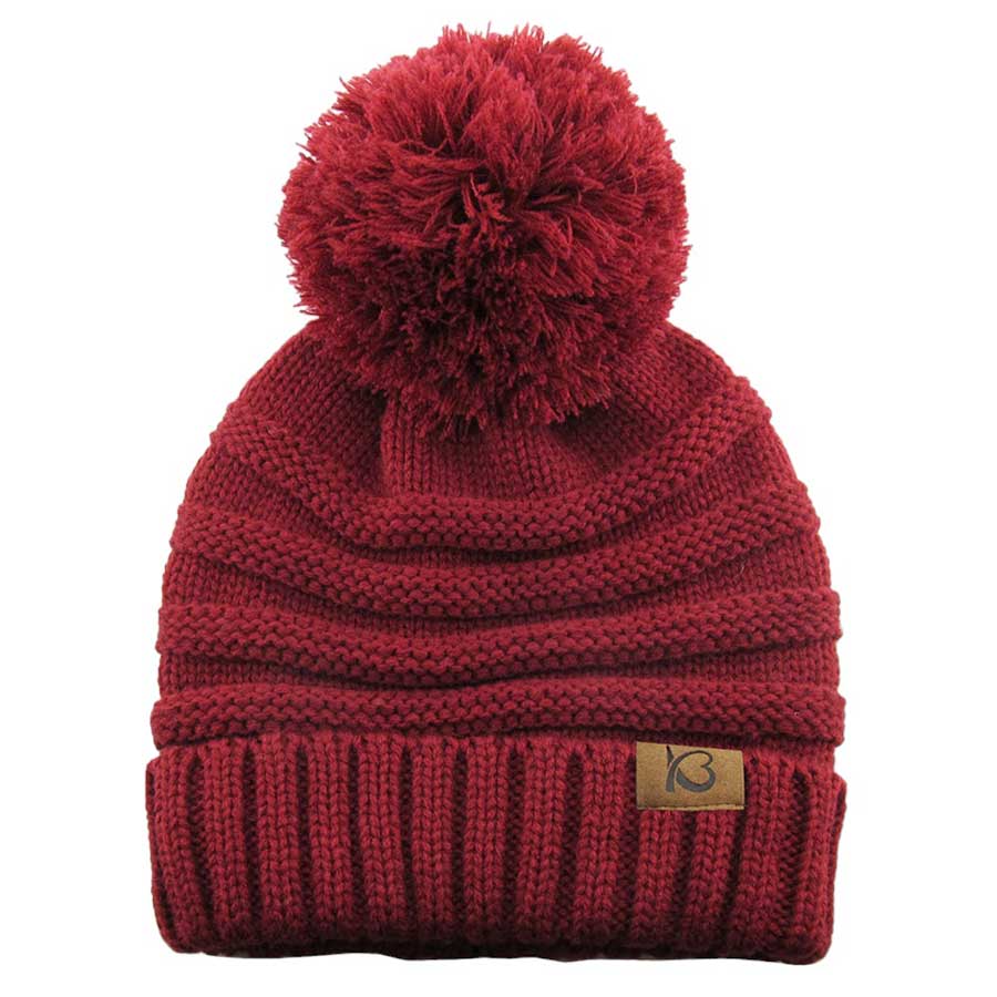 Burgundy Cable Knit Ribbed Chunk Pom Pom Comfy Winter Beanie Hat. Before running out the door into the cool air, you’ll want to reach for this toasty beanie to keep you incredibly warm. Accessorize the fun way with this pom pom hat, it's the autumnal touch you need to finish your outfit in style. Awesome winter gift accessory!