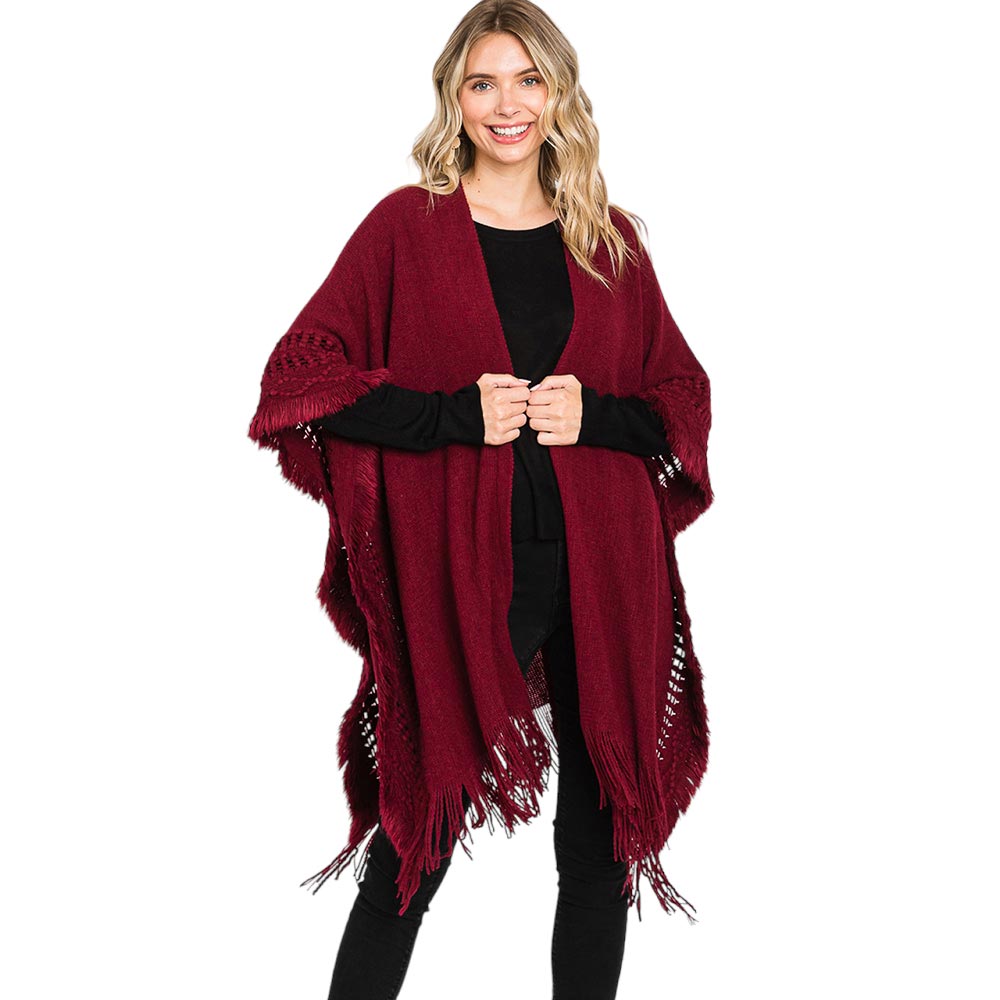 Black Fringe Cut Out Knit Ruana Poncho, with the latest trend in ladies' outfit cover-up! the high-quality knit poncho is soft, comfortable, and warm but lightweight. It's perfect for your daily, casual, party, evening, vacation, and other special events outfits. A fantastic gift for your friends or family.