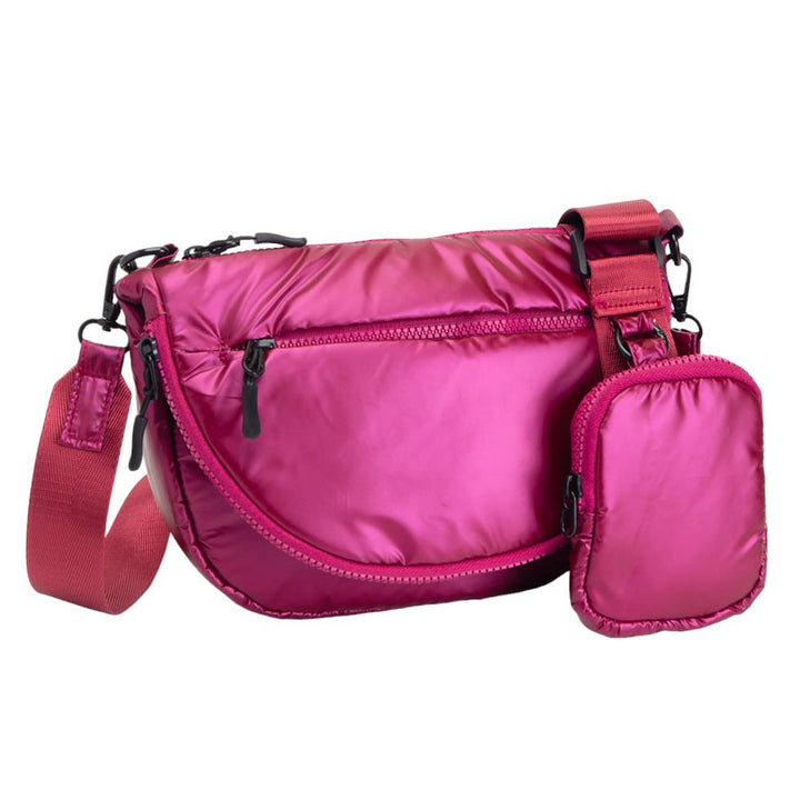 Burgundy Glossy Puffer Half Moon Crossbody Bag, the lightweight, stylish design features a durable water-resistant nylon that is perfect for outdoor activities. The adjustable shoulder strap makes it easy to sling across your body for hands-free convenience. Carry your essentials in style and comfort with this fashionable bag.