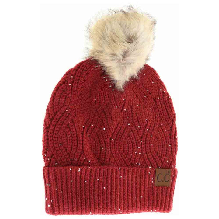 Burgundy Sequin Brioche Cable Knit Fur Pom C.C Beanie combines classic craftsmanship with a modern touch. Featuring a soft brioche cable knit pattern enhanced by subtle sequins, this beanie adds understated sparkle to cold-weather style. The plush fur pom enhances warmth and a refined aesthetic, making it an ideal accessory for both functionality and fashion during chilly days. Durable and comfortable, it delivers expert-level design that complements any winter wardrobe. 